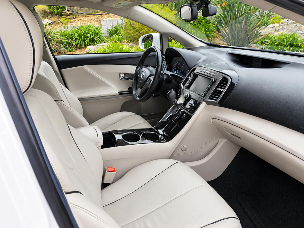 Clean beige leather vehicle interior after detailing
