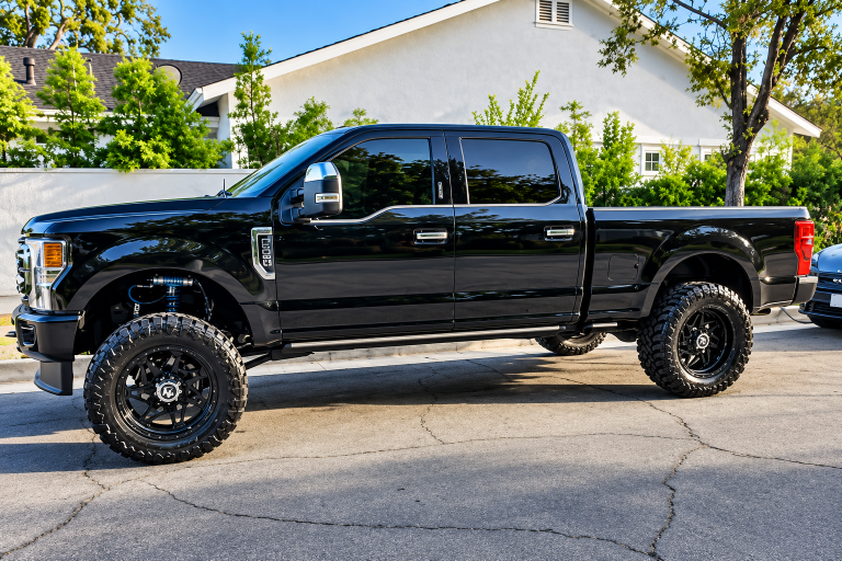 Glossy Lifted F-350 on a Suburban Street