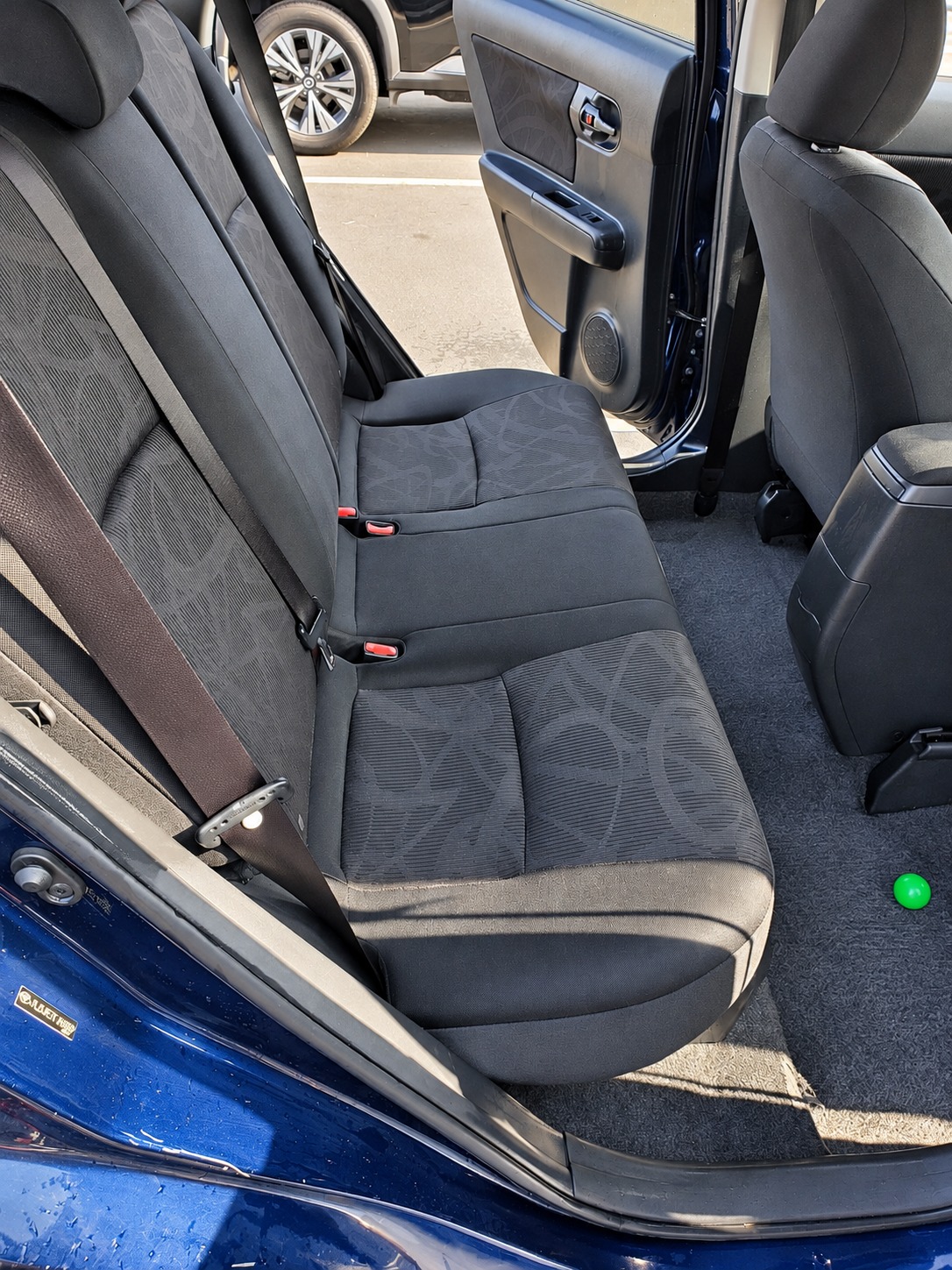 The same patterned rear seats after the spills have been cleaned
