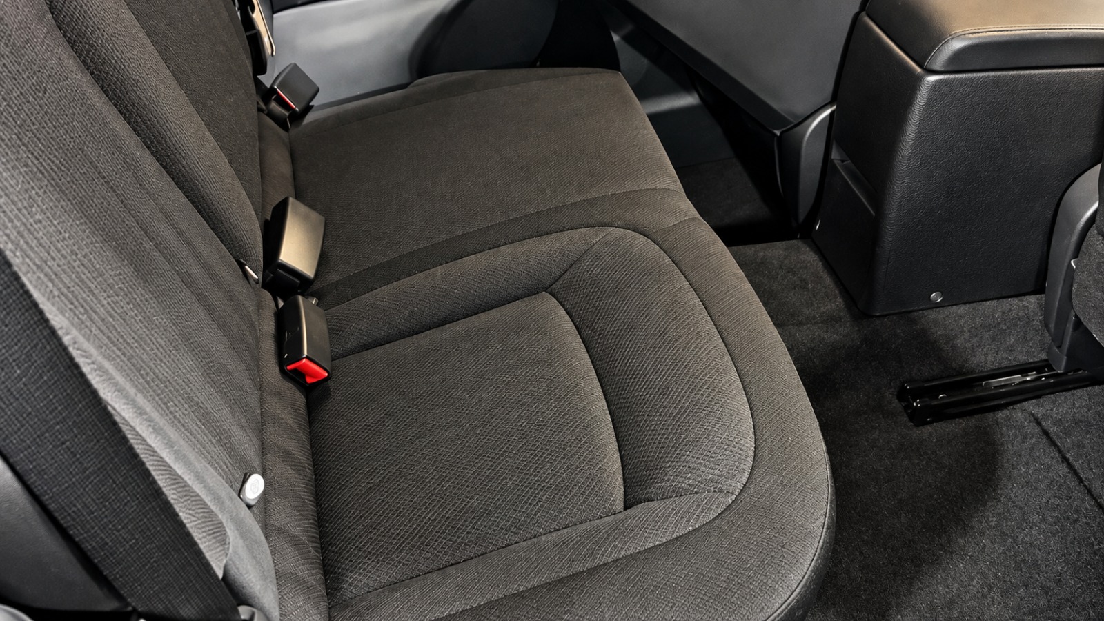 The same dark fabric rear bench after pet hair removal