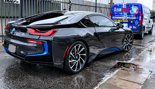 Rain-Slick BMW i8 Industrial Lot